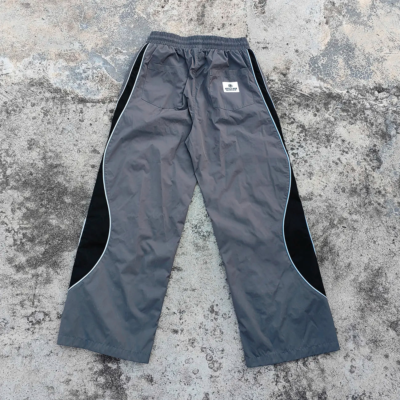 Printed logo Fashion Streetwear Woven Track Pants Custom Elastic Waist Color Block Design Wide Leg Men Baggy Tarck Pants
