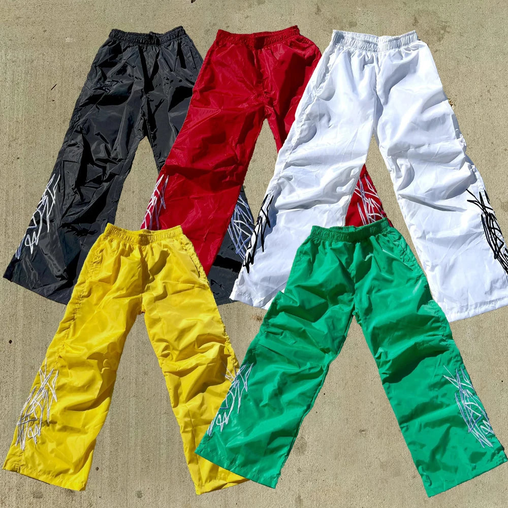 Huilin Oem Wholesale Elastic Waist Nylon Track Sweatpants Men Custom Printing Logo Straight Wide Leg Baggy Track Pants