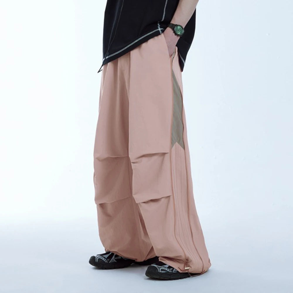 Huilin New Arrival Side Zip Design Oversized Fit Unisex Nylon Track Pants Elastic Waist Men Baggy Wide Leg Parachute Pants