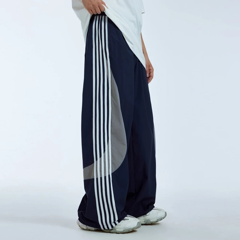 Huilin Summer New Trend Unisex Oversized Water Resistant Sportswear Pants Men Custom Stripe Side Baggy Widd Leg Track Pants