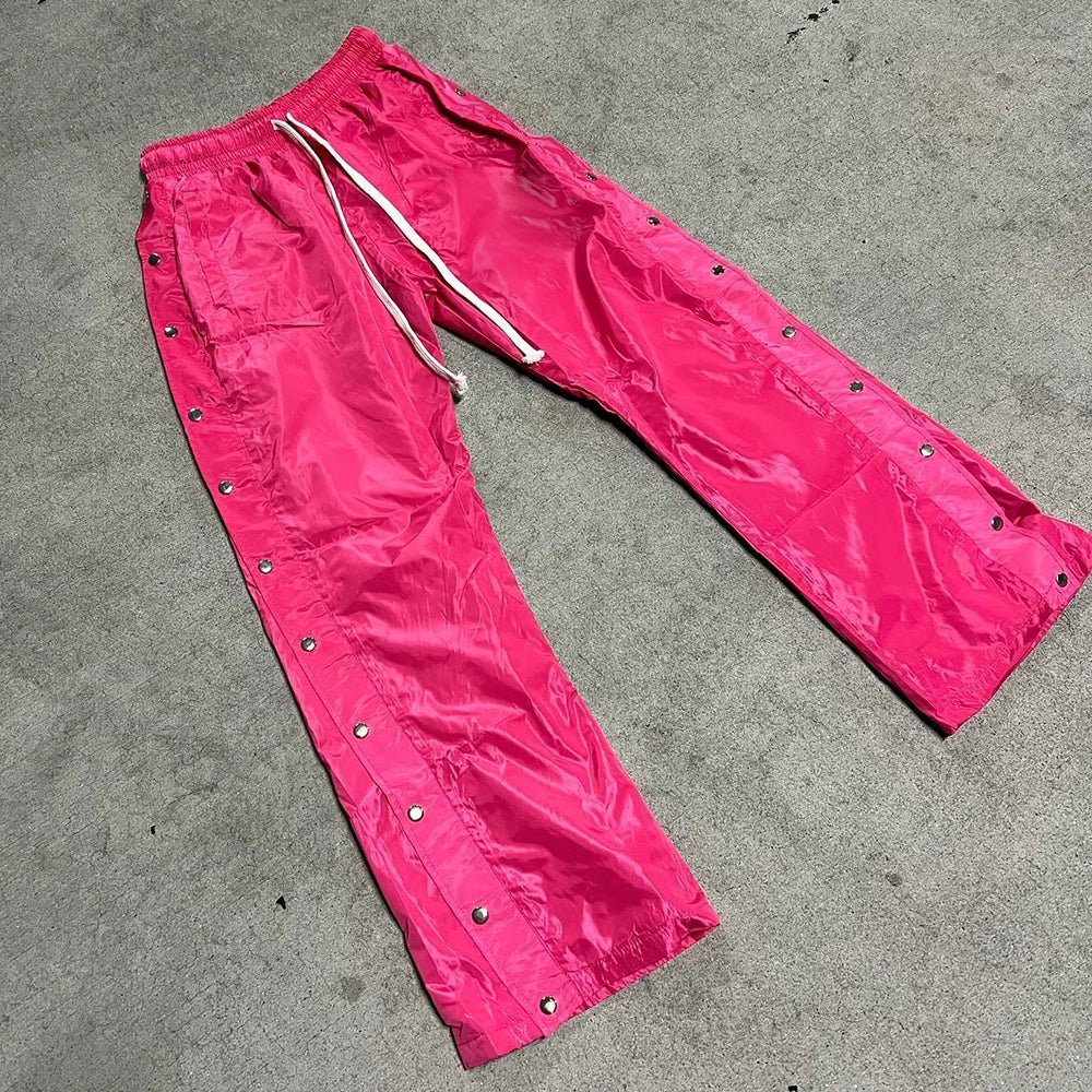 Huilin Wholesale Solid Color Blank Streetwear Nylon Pants Elastic Waist Men Custom Snap Button Side Wide Leg Track Pants