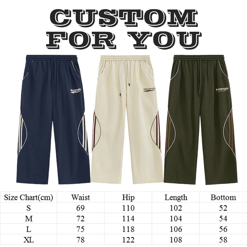 Huilin Wholesale New Trend Relaxed Fit Unisex High Street Sportswear Pants Custom Logo Printed Men Baggy Wide Leg Track Pants