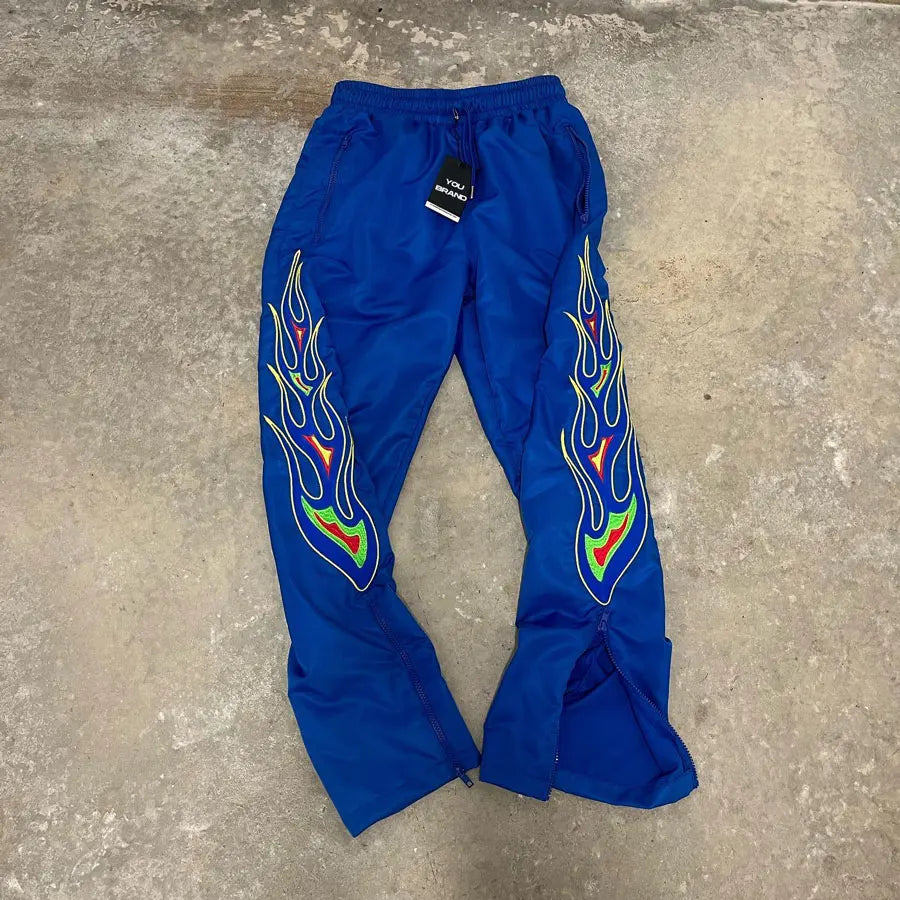 Huilin Hot Selling Basic Nylon Track Pants Men Custom Logo Graphic Print Zip Bottom Wide Leg Track Pants