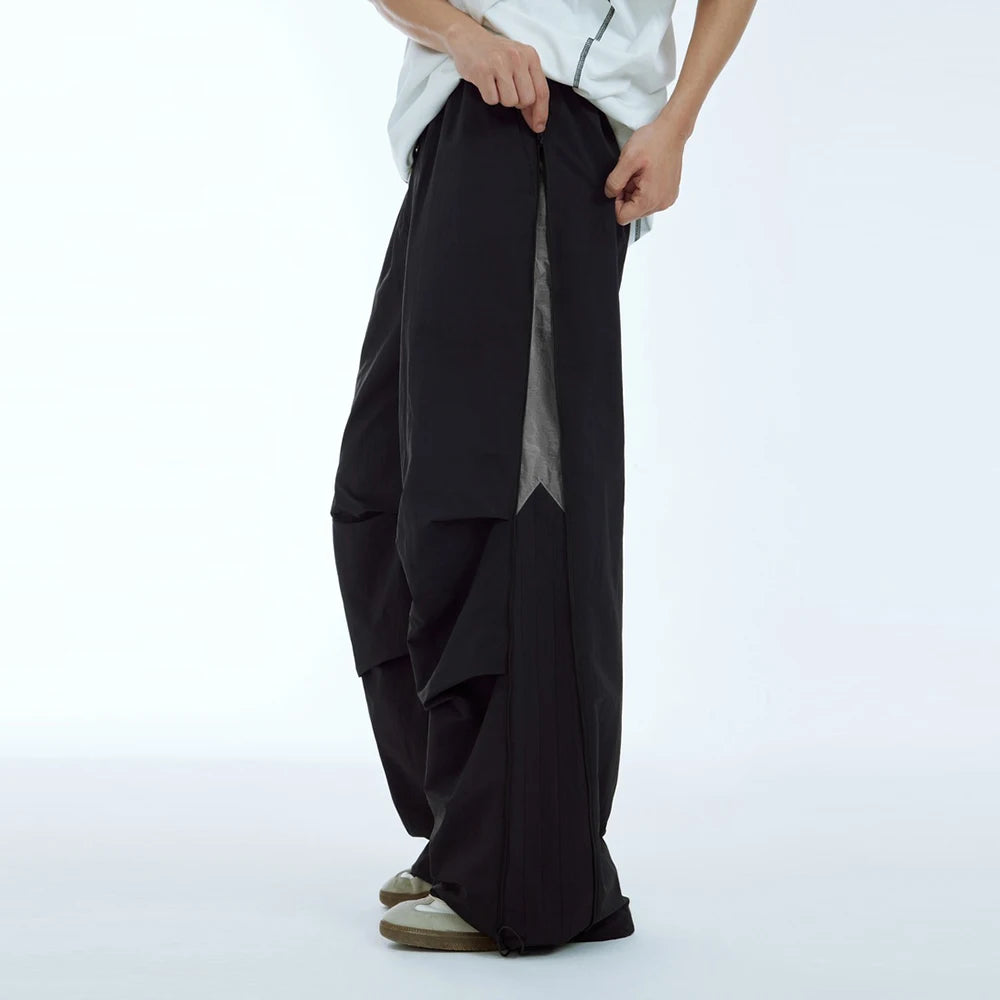 Huilin New Arrival Side Zip Design Oversized Fit Unisex Nylon Track Pants Elastic Waist Men Baggy Wide Leg Parachute Pants