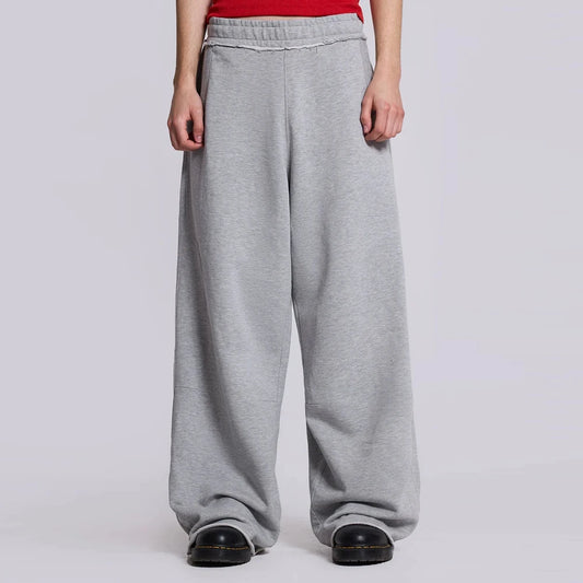 huilin oem high street oversized unisex heavyweight sweat pants elastic waist solid color men baggy wide leg raw hem sweatpants