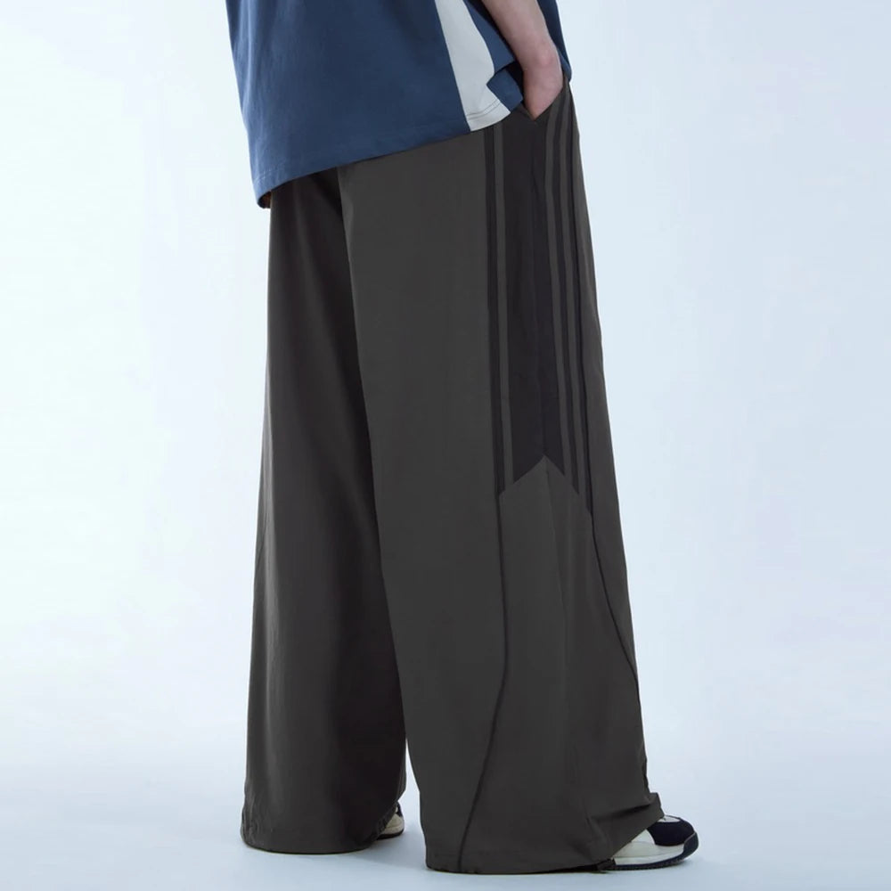 Huilin Oem Wholesale Adjustable Bottom Oversized Track Pants Men Custom Contrast Stripe Baggy Wide Leg Parachute Pants