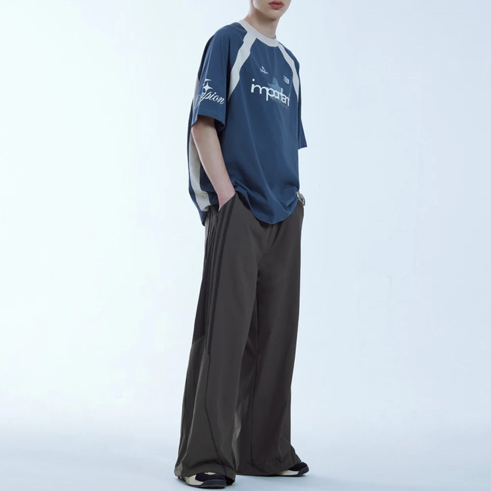 Huilin Oem Wholesale Adjustable Bottom Oversized Track Pants Men Custom Contrast Stripe Baggy Wide Leg Parachute Pants