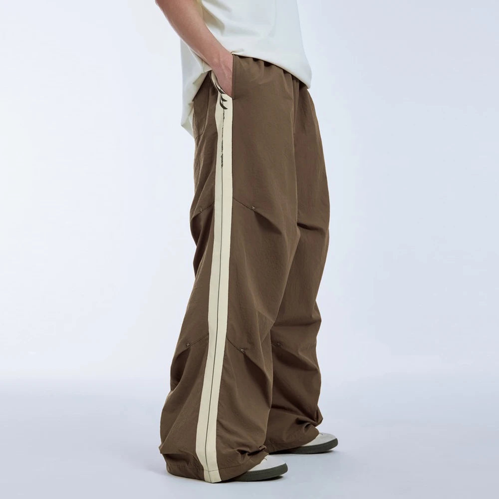 Huilin Hot Selling Oversized Fit Cargo Track Pants Men Custom Side Stripe Straight Wide Leg Baggy Parachute Pants